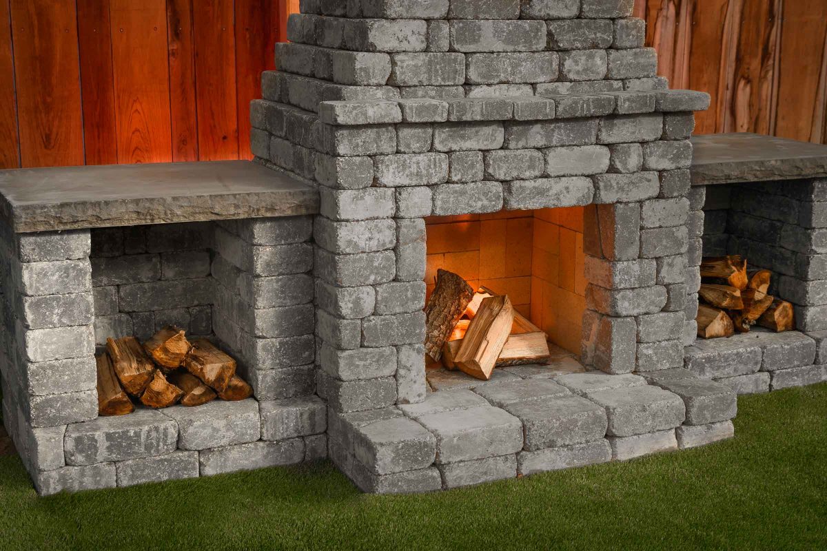 Fremont II outdoor fireplace kit with wood boxes Charcoal Blend. 